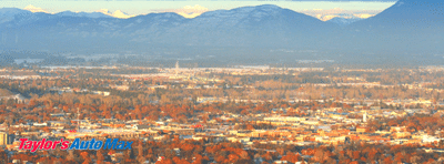 Kalispell MT city view with taylor's auto max logo in bottom left corner