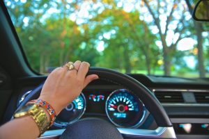 Hand driving on steering wheel